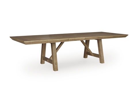 Long wooden farmhouse dining table with sturdy trestle legs on a white background.